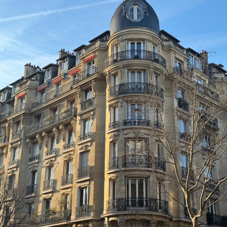 A tall building with a clock on the top of it