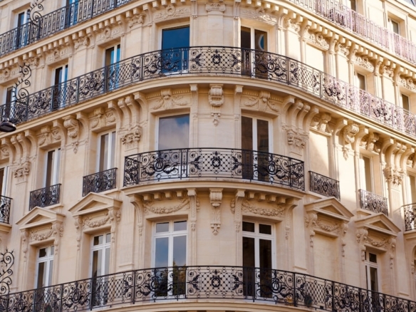 Ornate parisian building with balconies and windows