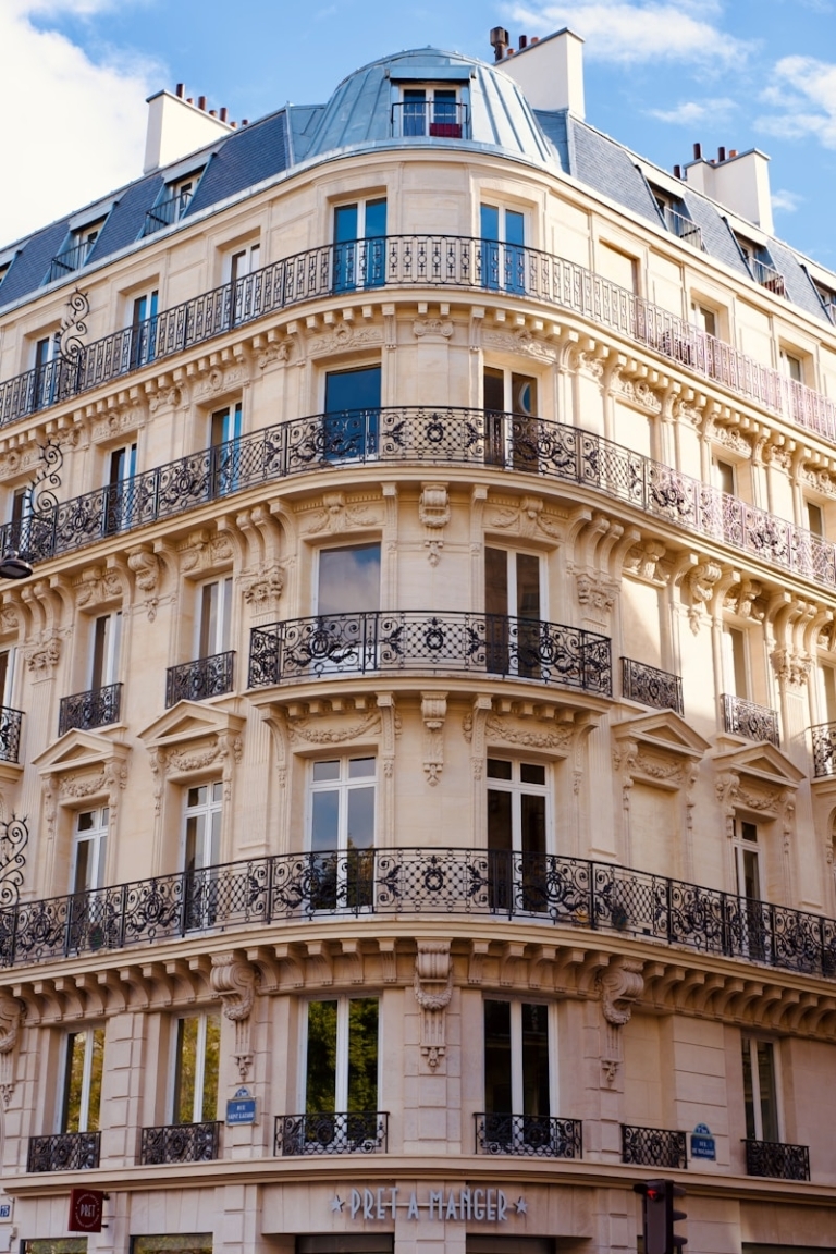 Ornate parisian building with balconies and windows